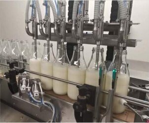 Flaschenabfüllanlage mit Deckelsortierer und Bedeckelung